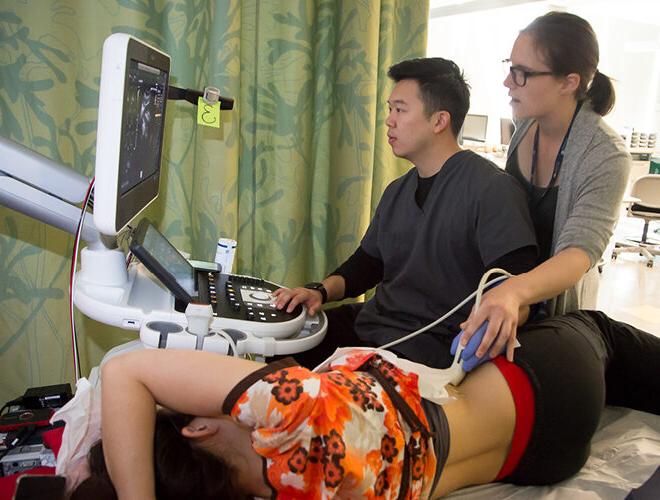 A BC student learns to use ultrasound technology.